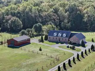 Custom Brick Retreat with Pool and Equestrian Barn