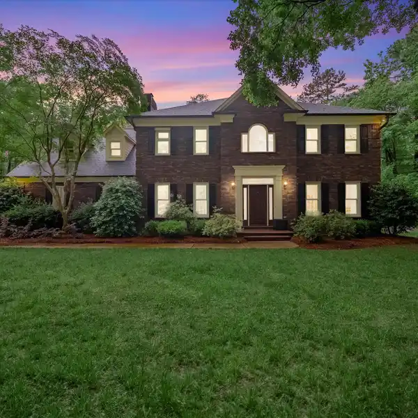 CHARMING BRICK HOME ON A WOODED LOT