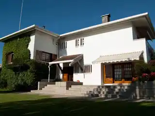 Elegant Four-Front Villa Surrounded by Lush Gardens