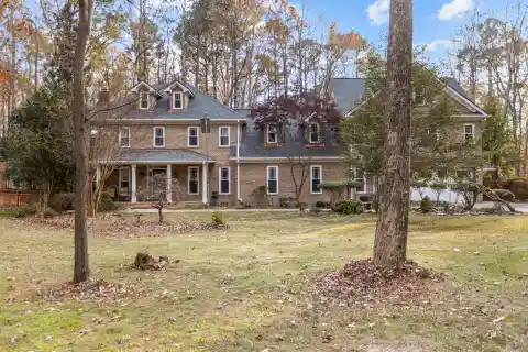 All Brick Estate Home in Sought-after Enchanted Oaks