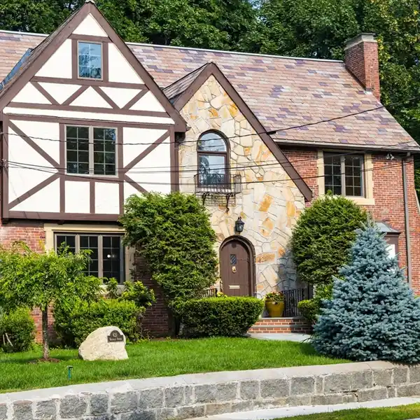 STUNNING BRICK TUDOR HOME ON A MAGNIFICENT CORNER LOT