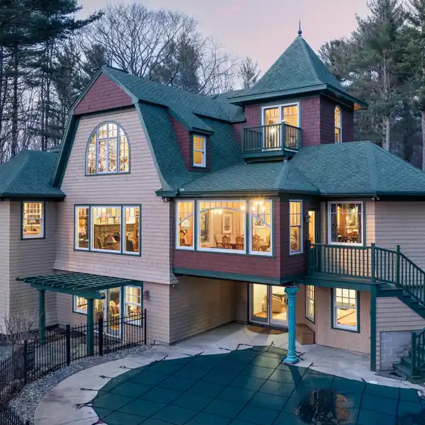 SHINGLE-STYLE HOME WITH CARRIAGE HOME ON OVER SIX ACRES