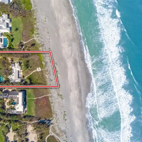 EXCLUSIVE BEACHFRONT SANCTUARY SURROUNDED BY LUSH LANDSCAPING