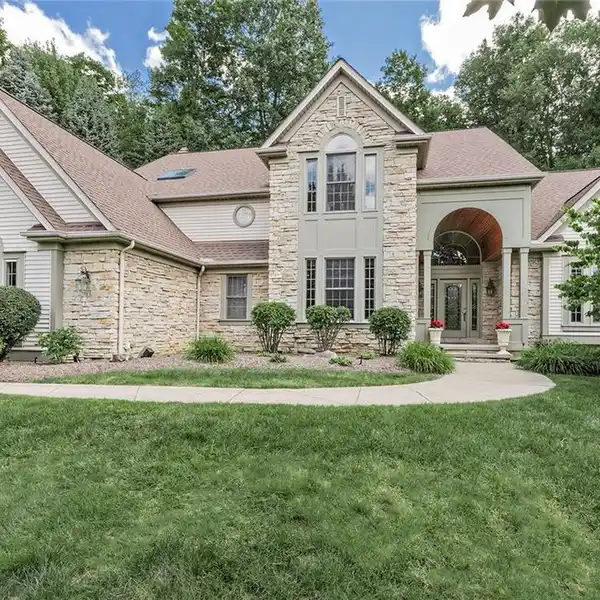 IMPRESSIVE CURB APPEAL MEETS REFINED INTERIORS