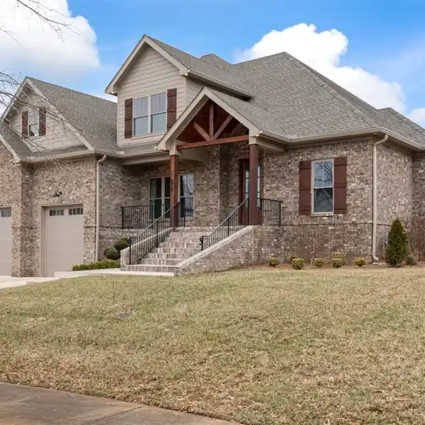 CUSTOM HOME IN THE PRESTIGIOUS OLDE STONE GOLF COURSE COMMUNITY