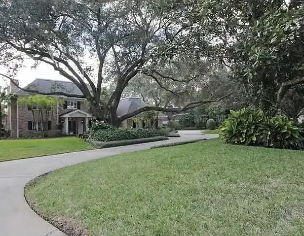 TIMELESS BRICK ESTATE WITH STUNNING LAKE VIEWS