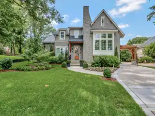 Storybook Modern Tudor Home with Carriage House