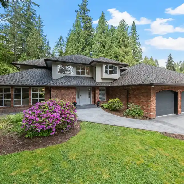 ELEGANT ESTATE WITH SERENE CREEKSIDE BACKYARD