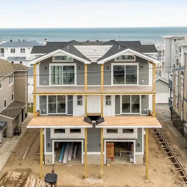 CUSTOM COASTAL RETREAT STEPS FROM THE BEACH