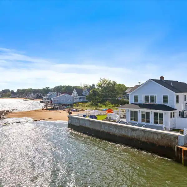 DOUBLE WATERFRONT GEM WITH SWEEPING COASTAL VIEWS