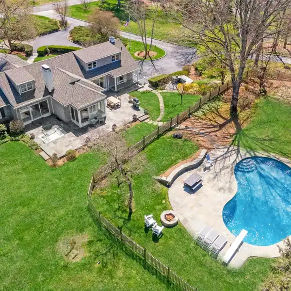 HAMPTONS-ESQUE CAPE COD ON VERDANT PROPERTY
