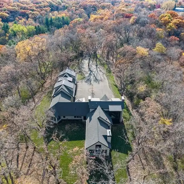 ONE-OF-A-KIND RETREAT ON A SECLUDED WOODED ACREAGE