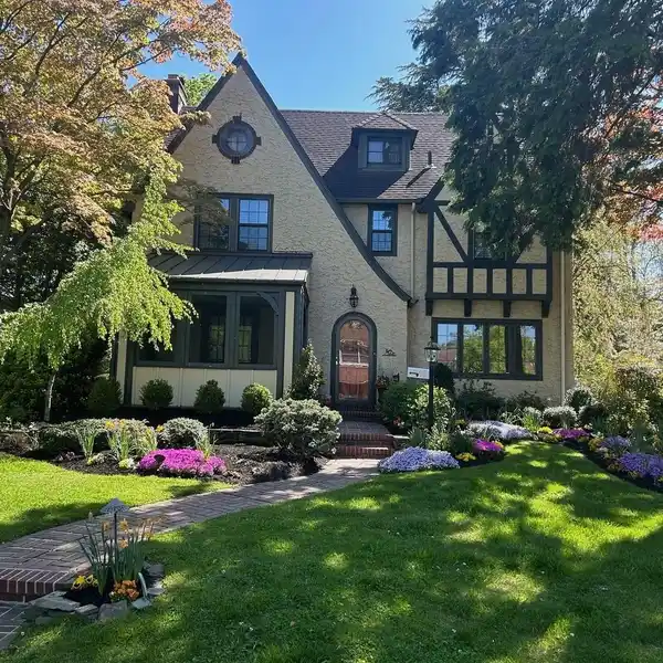 ELEGANT TUDOR-STYLE CENTER HALL COLONIAL