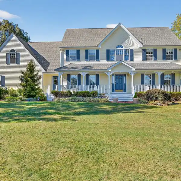 CLASSIC COLONIAL WITH ROCKING CHAIR FRONT PORCH