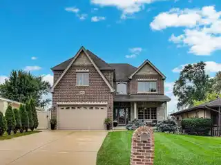 Spacious Brick Home with Luxurious Upgrades