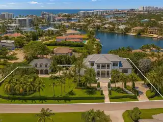 Fully Reimagined Estate on a Rare Corner Waterfront Lot