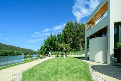 Architectural Villa with Private Mooring and Riverfront Views