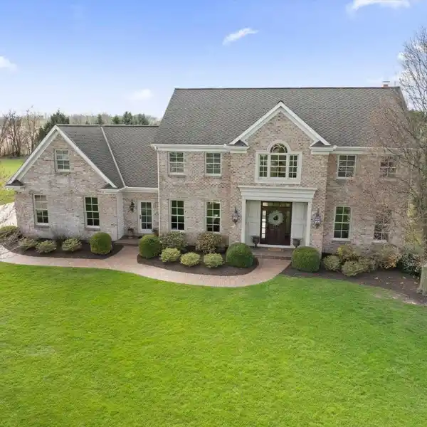 CUSTOM HOME IN A COUNTRY-LIKE SETTING