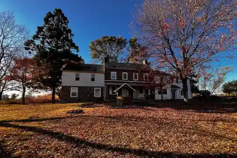 Brick Fireplace Anchors Formal Living Room