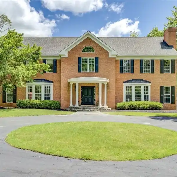 GRAND BRICK ESTATE SURROUNDED BY WOODS