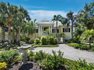 Gulf-Front Masterpiece with Bayside Boathouse