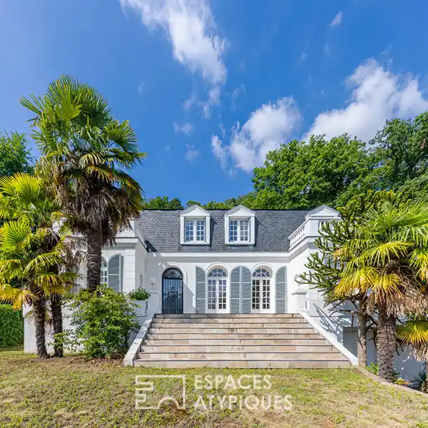 SERENE WOODED RETREAT WITH BRIGHT, OPEN INTERIORS