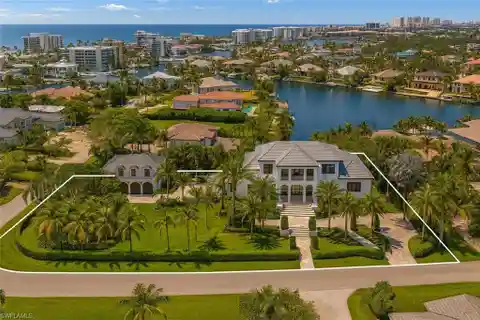 Fully Reimagined Estate on a Rare Corner Waterfront Lot