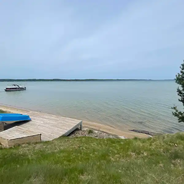 TORCH LAKE LEGACY LOT WITH HISTORIC SUMMER HOUSE