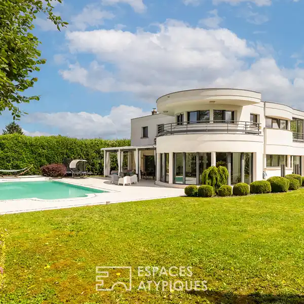 SPACIOUS HOME SURROUNDED BY PRIVATE WOODED GROUNDS