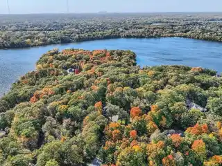 Custom Home on a Private Wooded Lot on the Island of Pleasant Lake