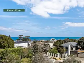 Beachside Classic with Bay Glimpses and Endless Potential