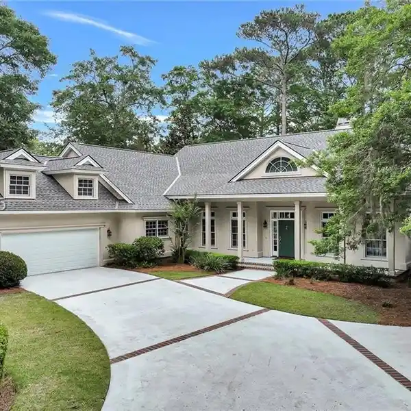 THIS CUSTOM HOME WITH LOWCOUNTRY CHARM IS COMPLEMENTED BY A PICTURESQUE SETTING ON THE SECOND HOLE OF THE GOLDEN BEAR GOLF COURSE