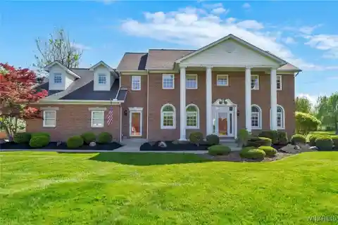 Stunning Brick-front Colonial with Sunroom Retreat