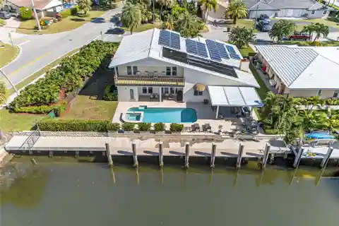 Expansive Waterfront Oasis with Solar-Powered Luxury
