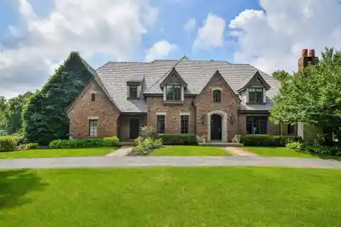 Stately All-Brick Home Framed by Circular Driveway
