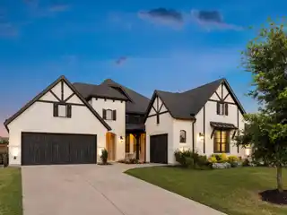 Modern Tudor Charm in the Heart of the  Mustang Lakes
