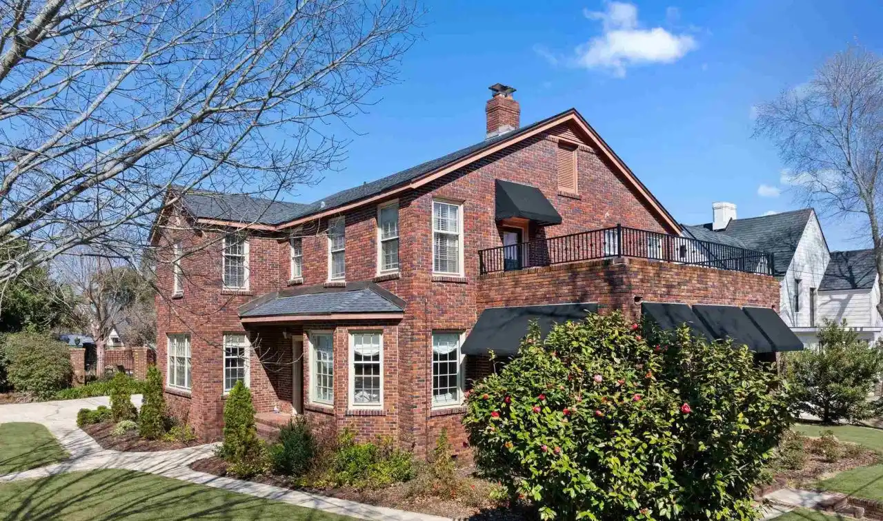 Tudor-style Brick Pool Home in Historic East Hill