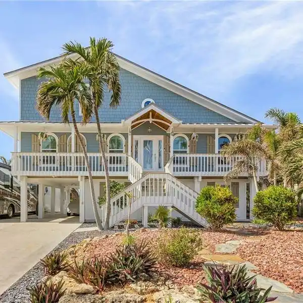 STUNNING WATERFRONT THREE-STORY POOL HOME