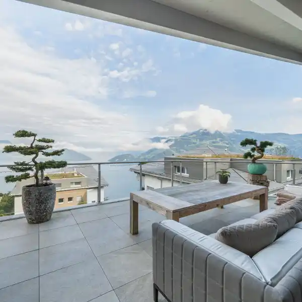 BREATHTAKING PANORAMA OF SHIMMERING LAKE AND MAJESTIC ALPINE PEAKS