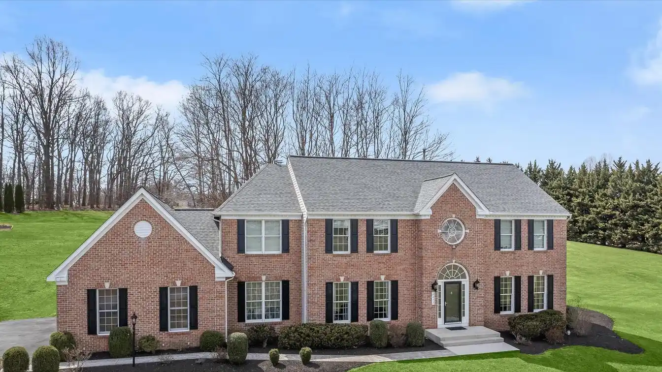 Exquisite Brick Front Colonial in Prestigious Challedon