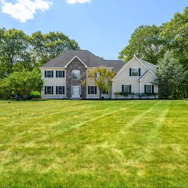 LOVELY COLONIAL-STYLE RESIDENCE BOASTING CURB APPEAL