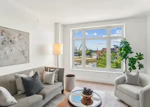 WATERFRONT HOME WITH STUNNING AMENITIES AND CITY VIEWS