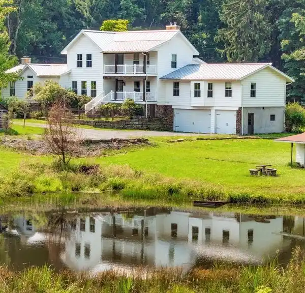 REDESIGNED FARMHOUSE RETREAT ON 20 SCENIC ACRES