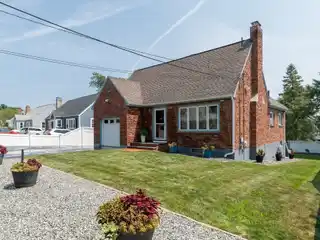 Meticulously Maintained and Expanded Cape Style Home