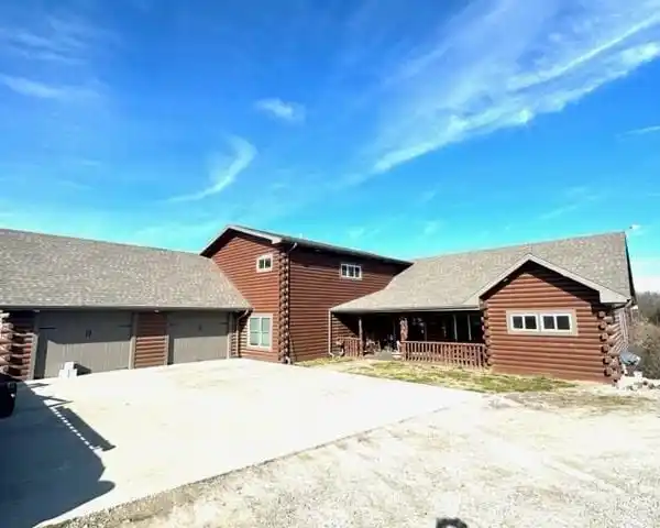 CUSTOM LOG HOME ON TEN ACRES
