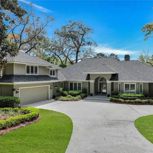 UPDATED RESIDENCE WITH SWEEPING FAIRWAY AND LAGOON VIEWS