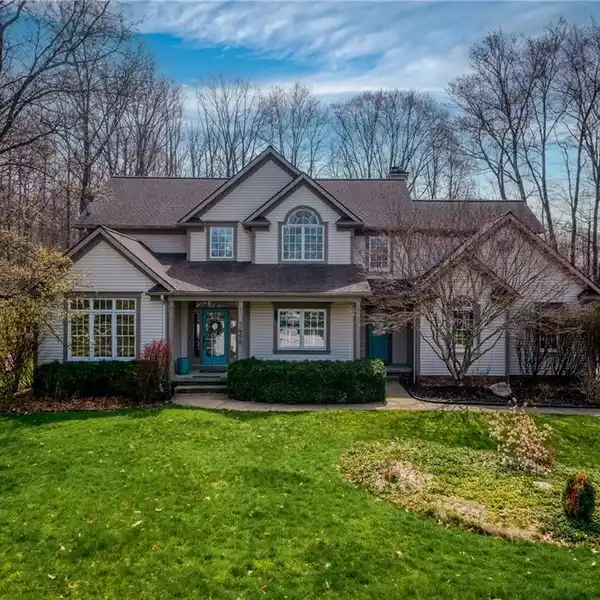BEAUTIFUL CUSTOM HOME ON A WOODED ACRE