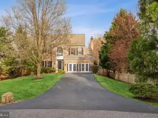 Luxe Brick Colonial with Backyard Paradise