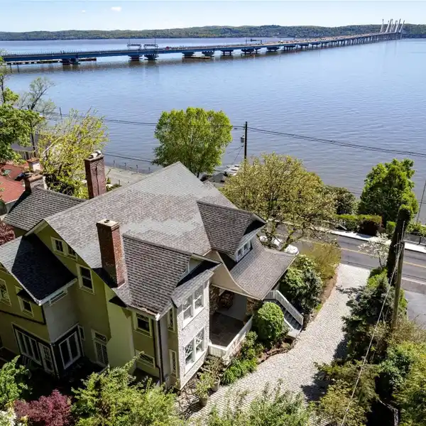 TIMELESS ELEGANCE WITH MODERN CONVENIENCE AND SWEEPING RIVER VIEWS