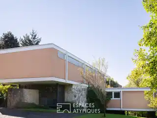 Architectural Masterpiece Surrounded by Wooded Grounds